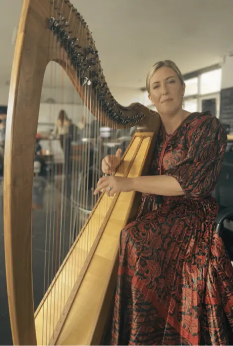 Lucia McGinnis with her harp